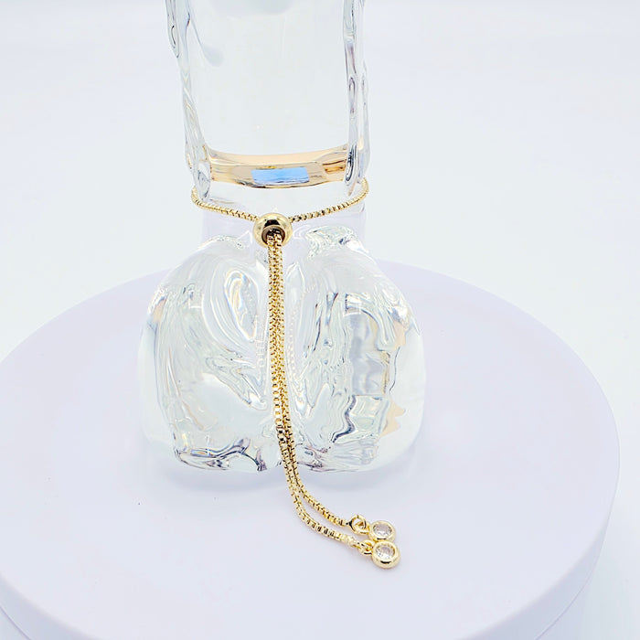 18k Gold Penis Noose Bracelet with Bright Blue Gem.