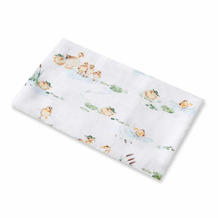 White baby swaddle blanket with baby ducklings