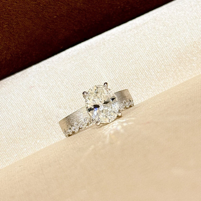 Elegant Textured Band & Side Stones Solitaire Oval Cut Sterling Silver Ring