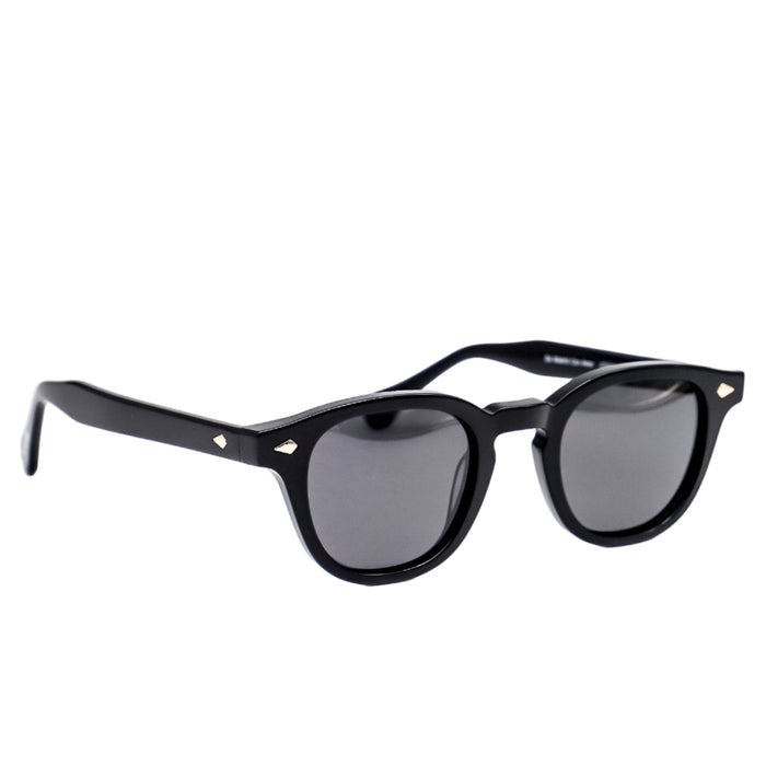 Black sunglasses with dark lenses on a white background