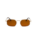 Sunglasses with gold frame and brown lenses on a white background