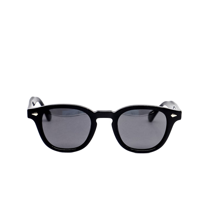 Black sunglasses with dark lenses on a white background