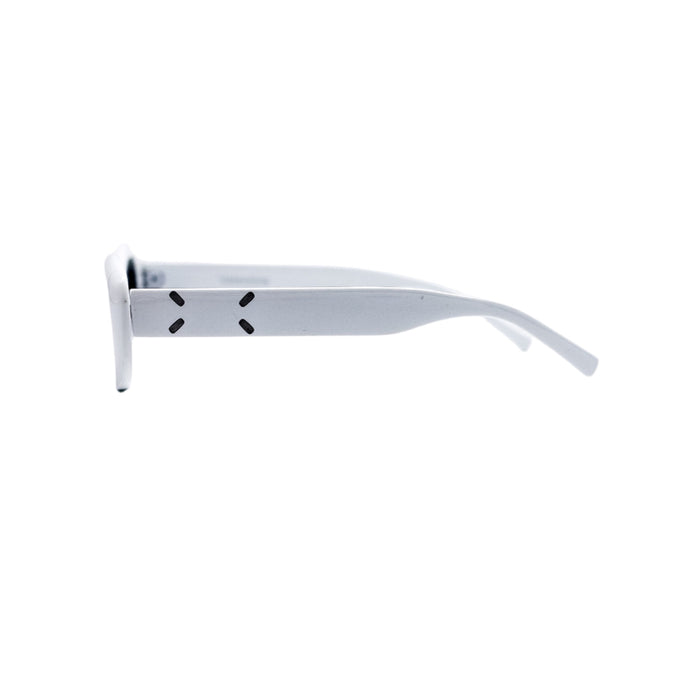 White eyeglasses on a light gray background