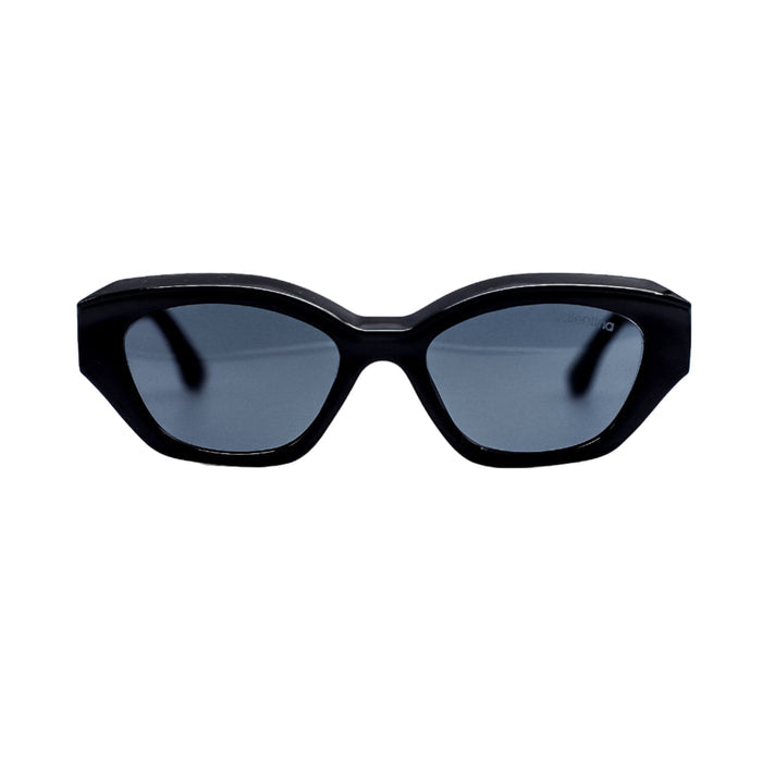 Black sunglasses with dark lenses on a white background
