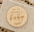 Wooden disc 'We're having a baby'